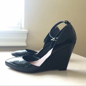 Black patent wedges shoes. In morning day lighting